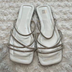 Never worn white flat sandals with beaded bands. Size 10
